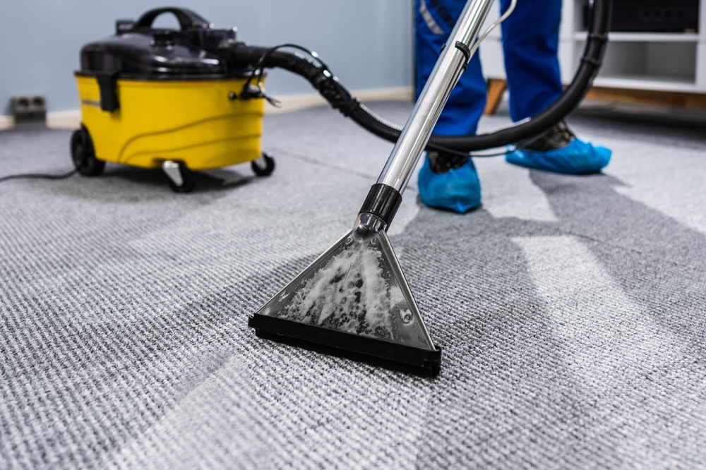 Photo,Of,Janitor,Cleaning,Carpet,With,Vacuum,Cleaner