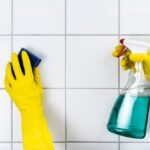 Tile,Wall,Grout,Cleaning,With,Sponge,And,Goggles