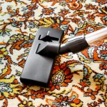 Cleaning old rug with a vacuum cleaner with universal nozzle